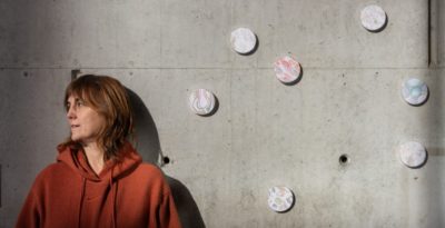 Gemma París with some of the drawings from La vida junts at the Barcelona Biomedical Research Park. Credit: Núria Grau.