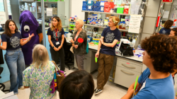Group of visitors in a PRBB laboratory during an OpenPRBB guided tour.